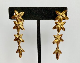 Monet Gold tone falling stars flowers clip-on 2" long earrings