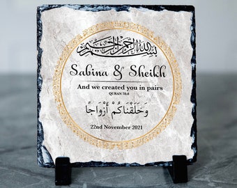 May include: A decorative slate plaque with a gold-colored border and Arabic calligraphy. The plaque features the names "Sabina & Sheikh" and the text "And we created you in pairs, Quran 78:8" and "وَخَلَقْنَاكُمْ أَزْوَاجًا". The date "22nd November 2021" is also included.