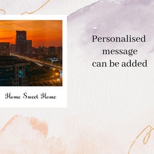 May include: A photo of a city skyline at sunset with the text "Home Sweet Home" below the image. The text "Personalised message can be added" is on the right side of the image.