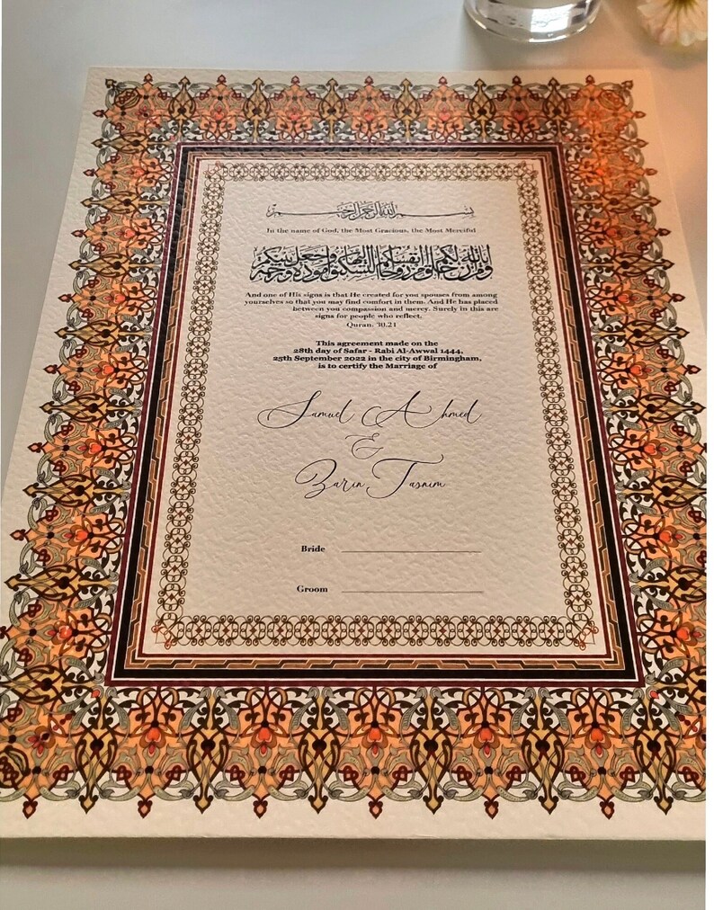 May include: A decorative Islamic marriage certificate with an ornate border in shades of orange, brown, and gold. The text reads "To the name of God, the Most Gracious, the Most Merciful." and "This agreement made on the 28th day of Safar - Rabi Al-Awwal 1444, 9th September 2022 in the city of Birmingham, is to certify the Marriage of Samad Ahmed & Zara Tasnim. Bride Groom."