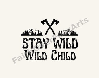 May include: A black graphic design on a light background featuring two crossed axes above a silhouette of a mountain range and pine trees. Below the graphic, the text reads STAY WILD WILD CHILD in a bold, distressed, and rounded black font.