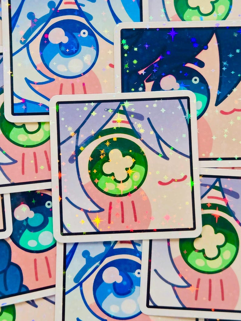 Pode incluir: Autocolantes quadrados com um desenho de olho de desenho animado. Os autocolantes apresentam uma borda branca e um acabamento hologr&aacute;fico. O design do olho inclui cores azul, verde, rosa e branco. Os autocolantes est&atilde;o espalhados.