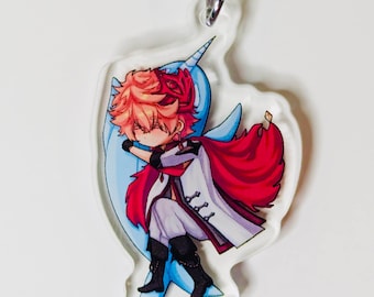 Pode incluir: Um chaveiro de acrílico transparente com um personagem de desenho animado com cabelo vermelho, uma roupa branca e vermelha e um narval azul e branco. O personagem está segurando o chifre do narval.