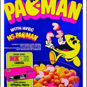 May include: A box of Pac-Man cereal with a yellow Pac-Man character on the front. The cereal is a mix of yellow, white, and pink pieces. The box also features a special offer for a neon camera.