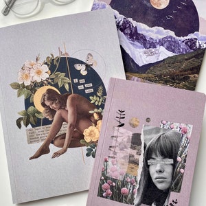 May include: Three different notebooks with collage art covers. The first notebook has a woman sitting with a butterfly and flowers. The second notebook has a moon and mountains. The third notebook has a woman's face with flowers and a quote that says "I am my own home".