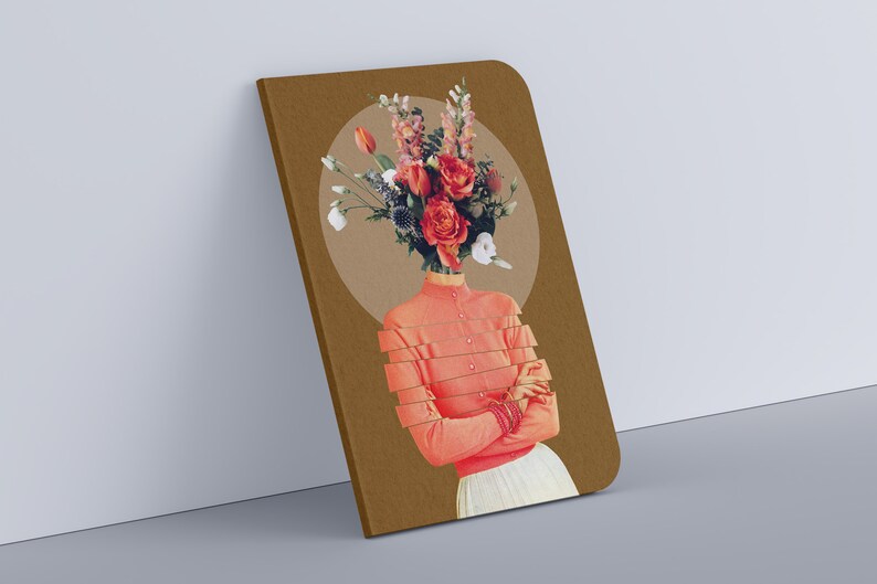 May include: A brown notebook with a floral collage on the cover. The collage features a woman with a bouquet of red, pink, and white flowers in place of her head. The background is a light brown circle.