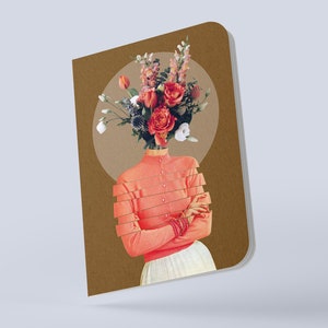 May include: A brown notebook with a collage of a woman with a bouquet of flowers for a head. The woman is wearing a pink shirt and a white skirt. The background is a brown circle.