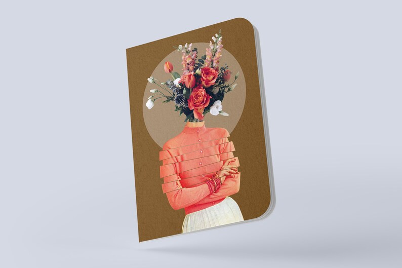 May include: A brown notebook with a collage of a woman with a bouquet of flowers for a head. The woman is wearing a pink shirt and a white skirt. The background is a brown circle.