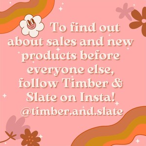 May include: A pink graphic sign with white text that reads: To find out about sales and new products before everyone else, follow Timber & Slate on Insta! @timber.and.slate. The design features orange and brown wavy lines and flowers.