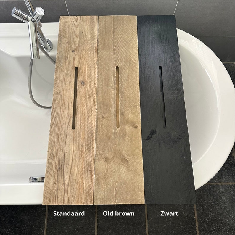 May include: Three wooden bath trays in different finishes: natural, brown, and black. The trays have a cutout in the center for holding bath products.