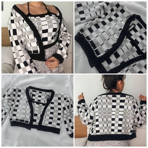 May include: A black and white checkered cropped cardigan with long sleeves. The cardigan is made of a soft, fuzzy yarn and has a relaxed fit.