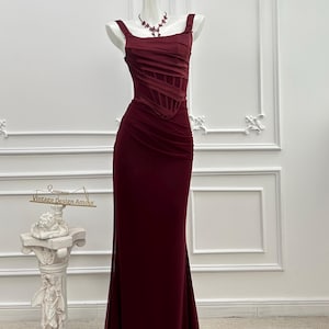 red dresses for older ladies Senior Woman Standing in Red Dress Stock Photo