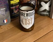 660ml hand-cut and sanded beer bottle soy wax candle. Each bottle made and poured by hand. A unique gift Blueberry and vanilla scent.