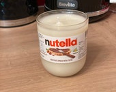 200g hand-cut and sanded nutella bottle soy wax candle. Each bottle made and poured by hand. A unique gift Chocolate Cookie scent.