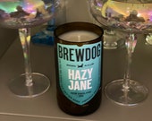 330ml hand-cut and sanded beer bottle soy wax candle. Each bottle made and poured by hand. A unique gift Blueberry and vanilla scent.