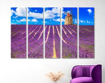 May include: A multi-panel canvas print depicting a field of purple lavender flowers with a windmill in the distance. The sky is blue with white clouds.