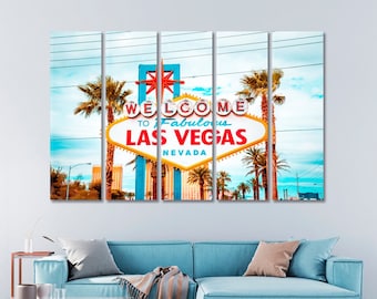 May include: A multi-panel canvas print featuring a vibrant, retro-style "Welcome to Fabulous Las Vegas" sign with palm trees and a blue sky in the background.