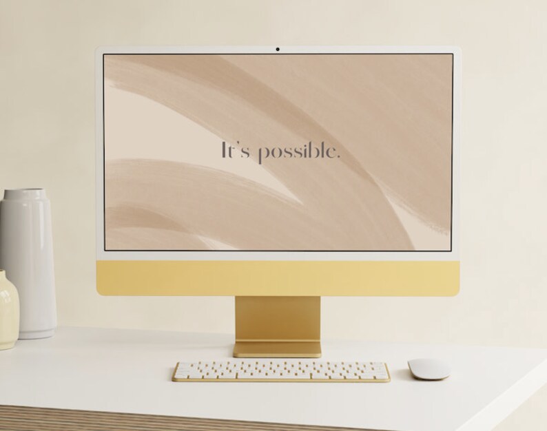 May include: A gold computer monitor with a white screen displaying a beige background with abstract brushstrokes and the text "It's possible." The monitor is on a white desk with a white keyboard and a white mouse.