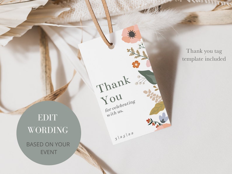 May include: A white thank you tag with a floral design in shades of pink, orange, green, and blue. The text on the tag reads "Thank You for celebrating with us. 3/25/22".