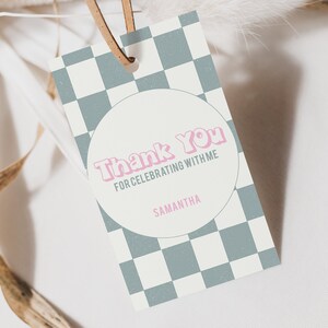 May include: A white and grey chequered thank you tag with a pink circle in the centre. The circle says "Thank You for celebrating with me" and "Samantha".
