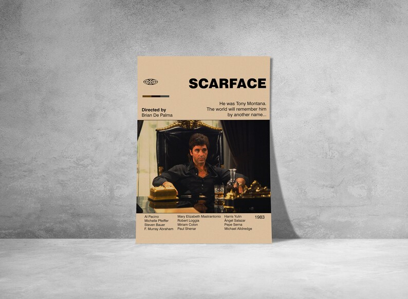 May include: A tan poster featuring the movie "Scarface" with the film's title in bold black letters. The poster includes a still image of Tony Montana, the film's main character. The poster also lists the director, cast, and the year 1983.