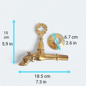 May include: A brass faucet with a decorative giraffe head spout. The faucet is 7.3 inches long, 5.9 inches tall, and includes a 2.6-inch diameter flange. The faucet has a detailed, ornate design.