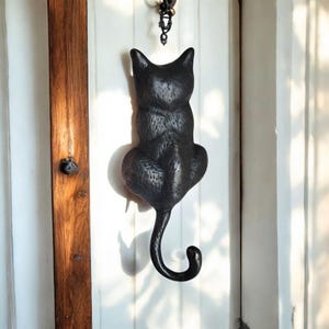 Elegant brass cat design door knocker in antique style