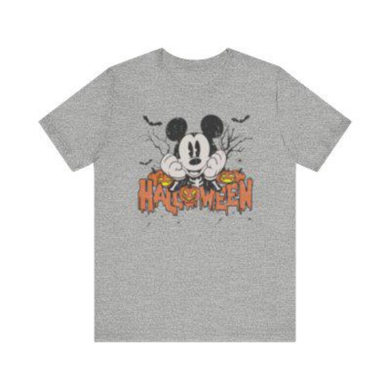 May include: A gray t-shirt with a vintage-style image of Mickey Mouse peeking out from behind a jack-o-lantern. The text "HALLOWEEN" is printed below Mickey Mouse.
