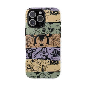 May include: A colorful phone case with a Halloween theme featuring Mickey Mouse, Minnie Mouse, Goofy, and Pluto. The case has a striped pattern with a purple, green, orange, and yellow color scheme.