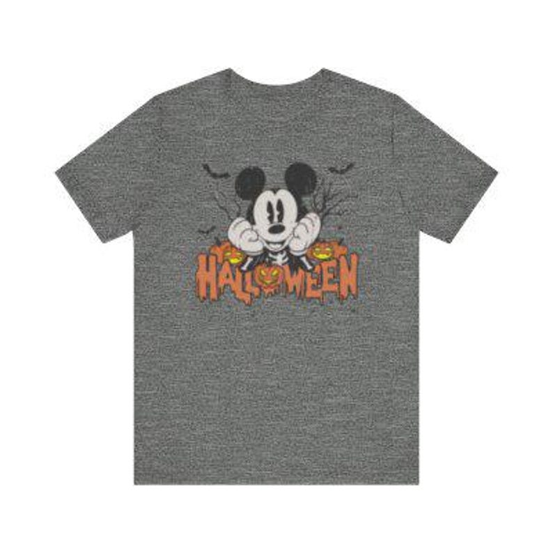 May include: A heather gray t-shirt with a cartoon image of Mickey Mouse peeking out from behind three jack-o'-lanterns. The text "HALLOWEEN" is printed in orange below the image.