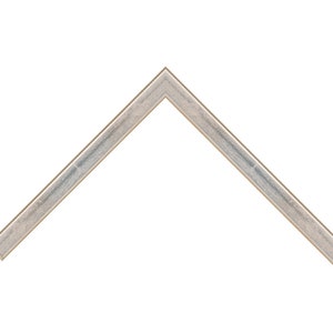 May include: A silver picture frame with a slightly textured surface.