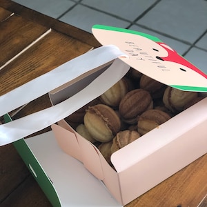 Walnut cookies with dulce de leche, condensed milk, caramel filled desert, handmade oreshki russian sweets, nuts and caramel, gift or treat