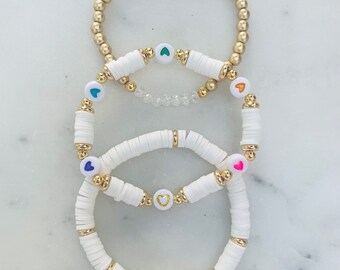 White Heishi Bead Bracelet Trio: Rainbow Heart, Gold Accents