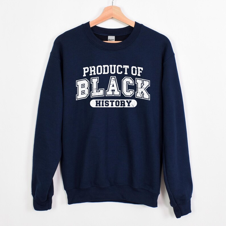 May include: Navy blue sweatshirt with white text that reads "Product of Black History".