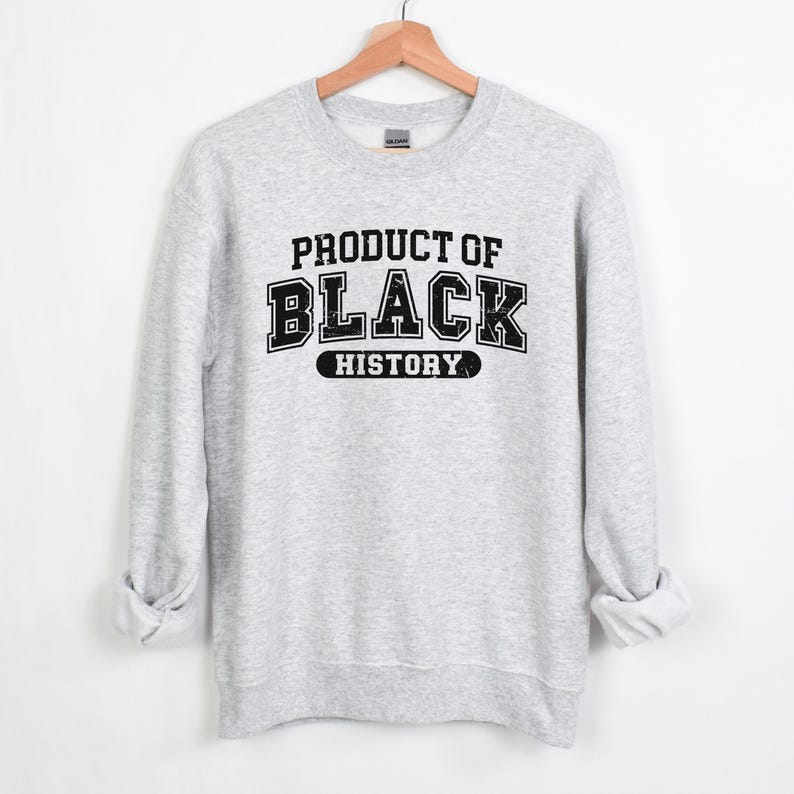 May include: Gray sweatshirt with black text that reads "Product of Black History".