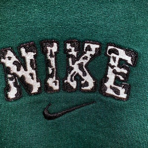 nike cow print embroidered sweatshirt