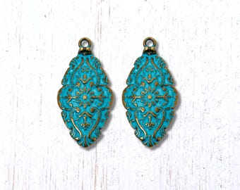 2 antique bronze floral pendants with blue patina, 56.5x28mm oversized alloy charms with embossed floral and scroll design (G0225)