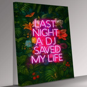 May include: An art print with a neon sign reading "LAST NIGHT A DJ SAVED MY LIFE" set against a backdrop of tropical plants and flowers. The artwork includes butterflies and a vibrant colour palette.