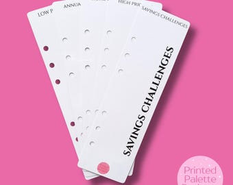 May include: White paper inserts with text for financial planning. The inserts have pre-printed titles like "Savings Challenges" and "Home F". Each insert has holes for binding and a pink background.