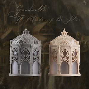 Puede incluir: Dos estructuras arquitect&oacute;nicas, una gris y otra beige, con intrincados arcos g&oacute;ticos, columnas y un techo abovedado con detalles ornamentados. El texto "Gondielle The Maiden of the Stone" aparece sobre las estructuras.