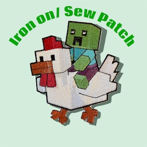 May include: Embroidered patch featuring a pixelated zombie riding a pixelated white chicken. The zombie is green, wearing a blue shirt and purple pants. The chicken has a red comb and brown beak. Text above reads "Iron on/ Sew Patch".