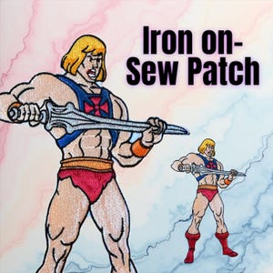 May include: Embroidered iron-on or sew-on patch featuring a muscular cartoon character with blonde hair, wearing red briefs, a blue harness, and holding a silver sword. The patch has the text "Iron on-Sew Patch" in black.