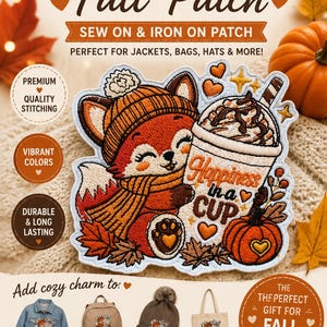 May include: An embroidered sew-on and iron-on patch featuring a cartoon fox wearing a beanie and scarf, holding a cup with the text Happiness in a CUP and a small pumpkin. The design includes autumn leaves and orange hearts on a white background.