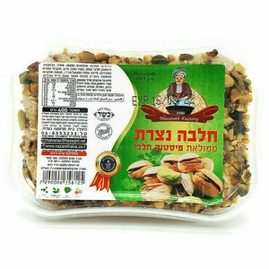 May include: A clear plastic container filled with a light brown halva, topped with pistachios. The label reads "Halva Nazareth" in Hebrew and English, with a picture of a man in traditional clothing. The label also includes the text "Pistachio Halva" in Hebrew and English.