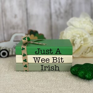 May include: A stack of three wooden blocks with a green, white, and green color scheme. The blocks are decorated with the text "Just A Wee Bit Irish".