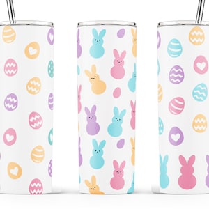 May include: Three stainless steel tumblers with different Easter-themed designs. The first tumbler features a pattern of pastel-colored eggs and hearts. The second tumbler features a pattern of pastel-colored bunnies and eggs. The third tumbler features a pattern of pastel-colored eggs and hearts.