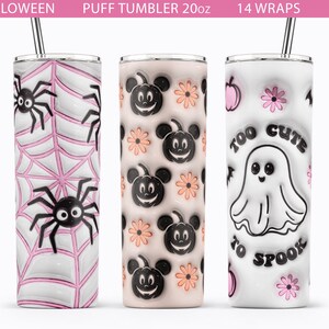 May include: Three 20 oz. stainless steel tumblers with Halloween designs. The first tumbler has a pink and white spider web pattern with black spiders. The second tumbler has a peach and white background with black Mickey Mouse heads and pumpkins. The third tumbler has a white background with a pink and black ghost with the text "Too Cute To Spook".
