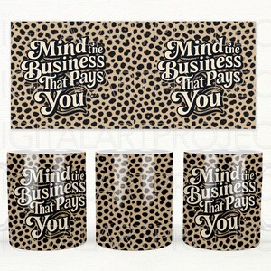 May include: A set of coffee mugs and a rectangular panel with a leopard print pattern. The text "Mind the Business That Pays You" is displayed in a decorative font. The mugs have white handles.