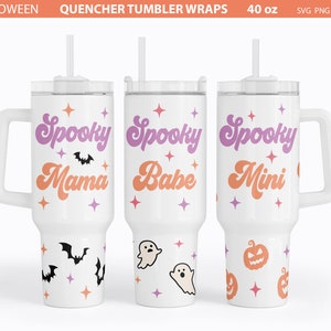 May include: Three white 40 ounce tumblers with lids and straws. The tumblers have different designs with the text "Spooky Mama", "Spooky Babe", and "Spooky Mini" in a retro font. Each tumbler has a different design with bats, ghosts, and pumpkins.