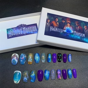 May include: A set of 18 Haunted Mansion themed press-on nails. The nails feature images of ghosts, the mansion, and the text "Haunted Mansion".